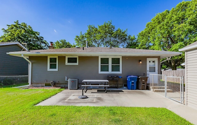 1022 Trisha Ave, Des Moines, IA 50313 - back of property with a patio area and a chimney