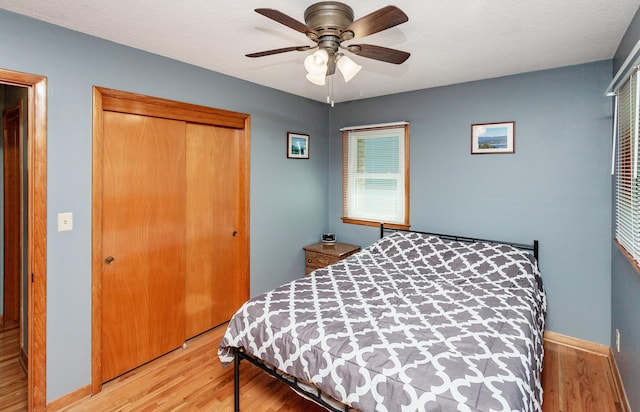 1022 Trisha Ave, Des Moines, IA 50313 - bedroom featuring a closet, wood finished floors, and ceiling fan