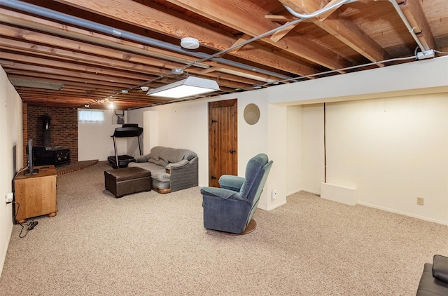 1022 Trisha Ave, Des Moines, IA 50313 - carpeted living area with a wood stove