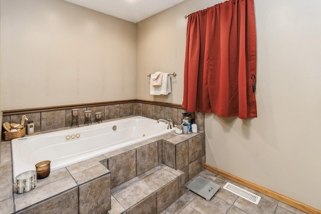 308 S 3rd St, Milo, IA 50166 - bathroom with a garden tub and tile patterned floors
