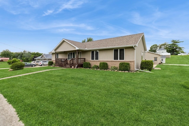308 S 3rd St, Milo, IA 50166 - ranch-style home featuring covered porch, a front lawn, roof with shingles, and brick siding