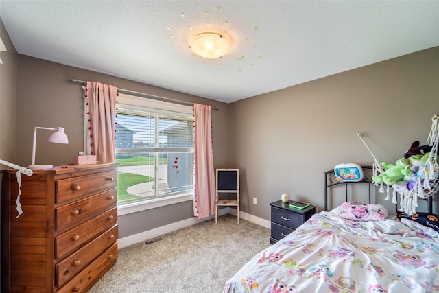 716 James St NE, Bondurant, IA 50035 - carpeted bedroom featuring baseboards