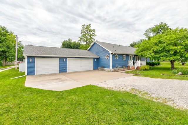 201 E 1st St, Woodward, IA 50276 - ranch-style home with concrete driveway, an attached garage, a front lawn, and a shingled roof