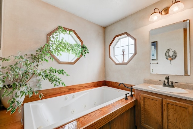 201 E 1st St, Woodward, IA 50276 - bathroom with vanity and a whirlpool tub