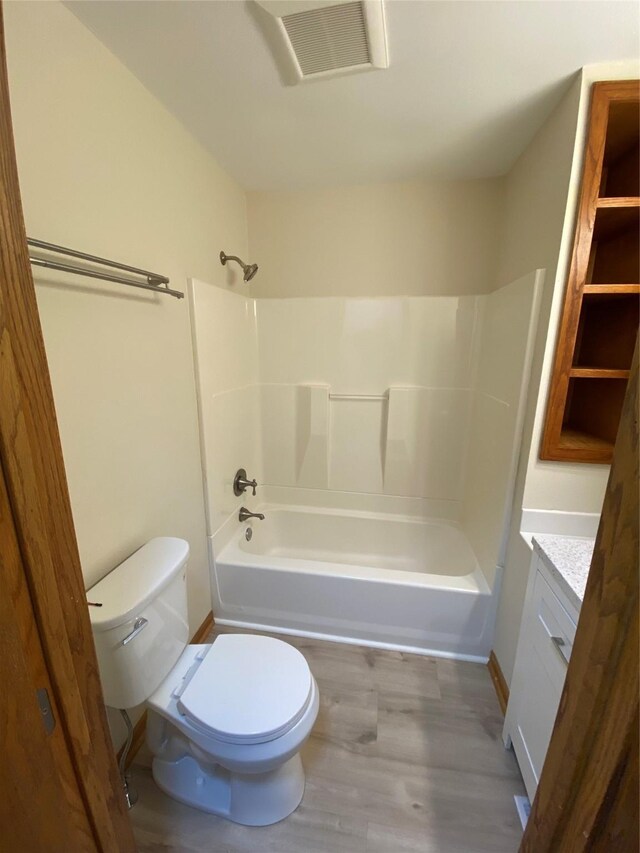 2615 59th St, Des Moines, IA 50322 - full bath with vanity, shower / bathtub combination, and wood finished floors