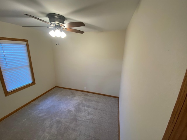 2615 59th St, Des Moines, IA 50322 - spare room featuring ceiling fan and carpet