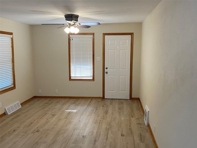 2615 59th St, Des Moines, IA 50322 - foyer entrance with light wood-style floors and a ceiling fan