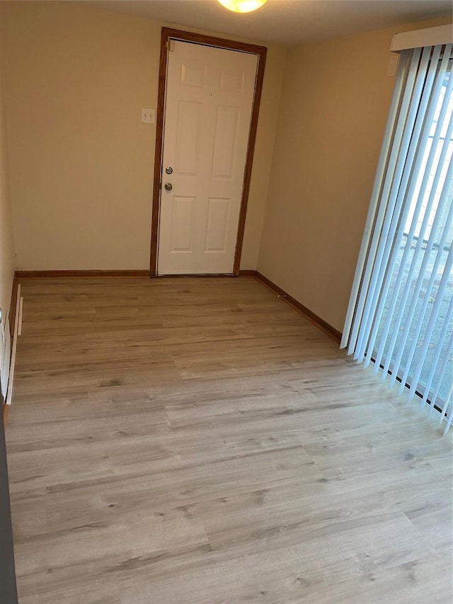 2615 59th St, Des Moines, IA 50322 - unfurnished room with light wood-type flooring and baseboards