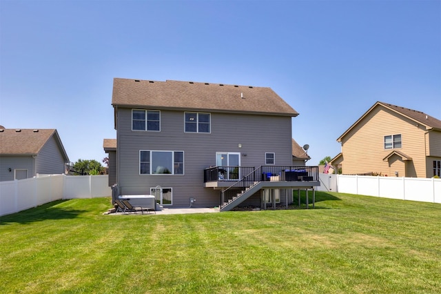4104 SW 2nd St, Ankeny, IA 50023 - back of house with stairway, a deck, a fenced backyard, and a patio area