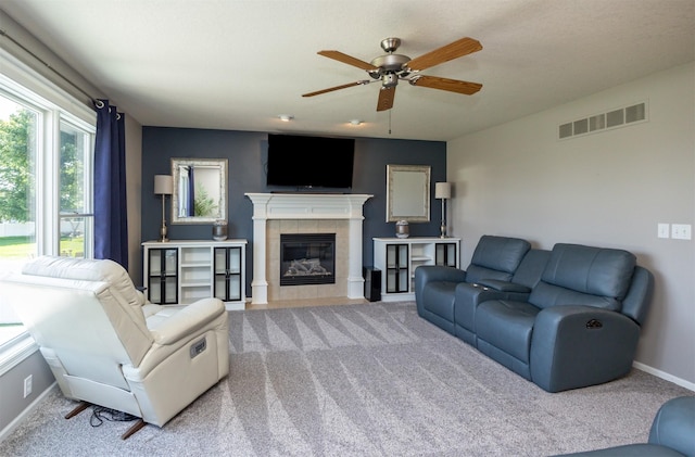 4104 SW 2nd St, Ankeny, IA 50023 - carpeted living room featuring ceiling fan and a tile fireplace
