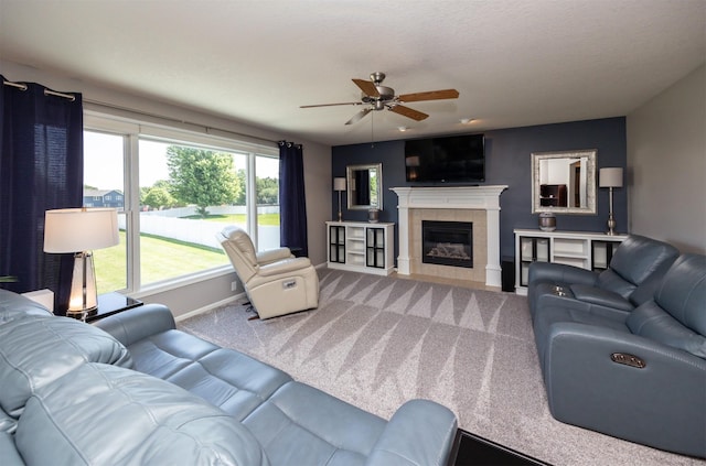 4104 SW 2nd St, Ankeny, IA 50023 - living area featuring carpet, ceiling fan, and a tiled fireplace
