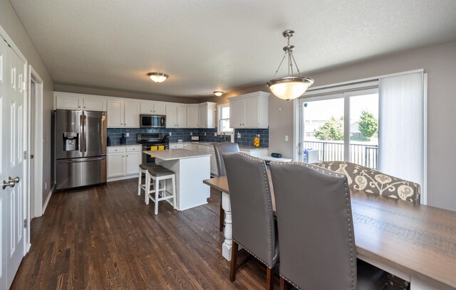 4104 SW 2nd St, Ankeny, IA 50023 - dining space featuring dark wood-type flooring
