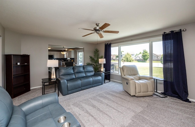4104 SW 2nd St, Ankeny, IA 50023 - carpeted living room with baseboards and a ceiling fan