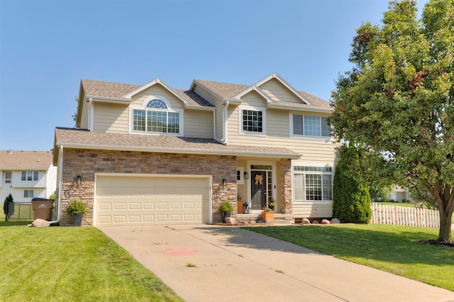 705 Patterson Dr, Carlisle, IA 50047 - view of front of house with driveway, an attached garage, stone siding, and a shingled roof