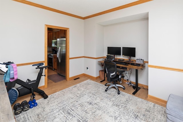 705 Patterson Dr, Carlisle, IA 50047 - office with light wood-style floors and ornamental molding