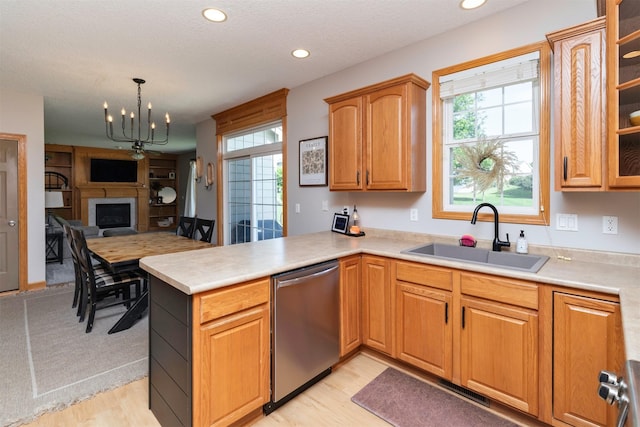 705 Patterson Dr, Carlisle, IA 50047 - kitchen featuring dishwasher, a peninsula, plenty of natural light, recessed lighting, and light countertops
