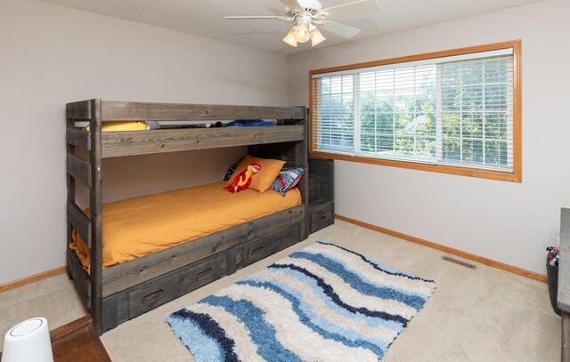 705 Patterson Dr, Carlisle, IA 50047 - bedroom with carpet flooring and a ceiling fan