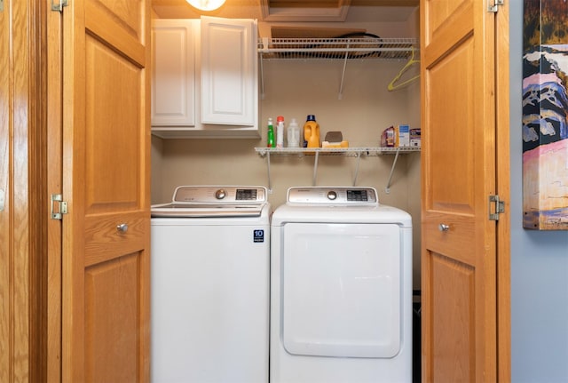 705 Patterson Dr, Carlisle, IA 50047 - laundry room featuring washing machine and dryer and cabinet space