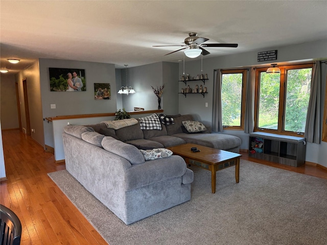 410 N 6th St, Winterset, IA 50273 - living room with a ceiling fan and light wood-type flooring