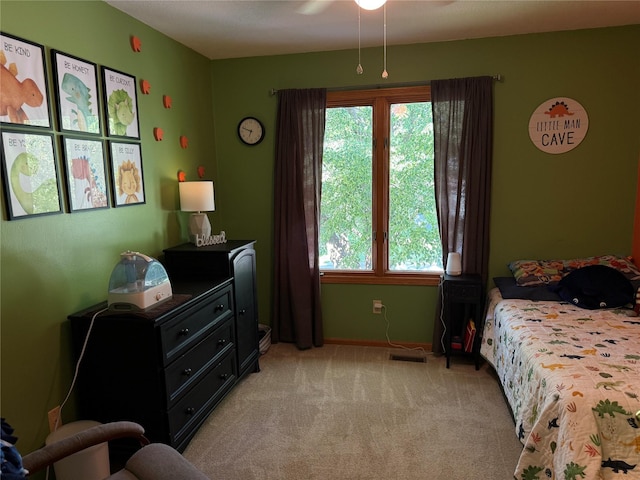 410 N 6th St, Winterset, IA 50273 - bedroom with light carpet and baseboards