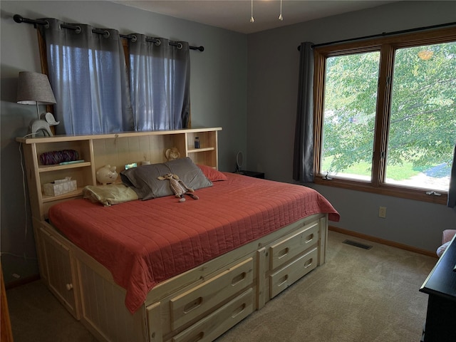410 N 6th St, Winterset, IA 50273 - bedroom featuring light carpet and baseboards