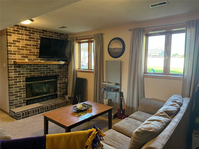410 N 6th St, Winterset, IA 50273 - living area with carpet flooring and a fireplace