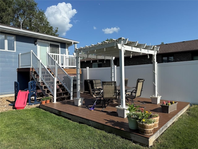 410 N 6th St, Winterset, IA 50273 - wooden deck with a pergola, outdoor dining area, and stairway