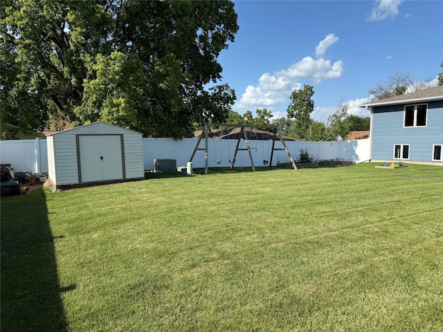 410 N 6th St, Winterset, IA 50273 - fenced backyard with a shed and a playground