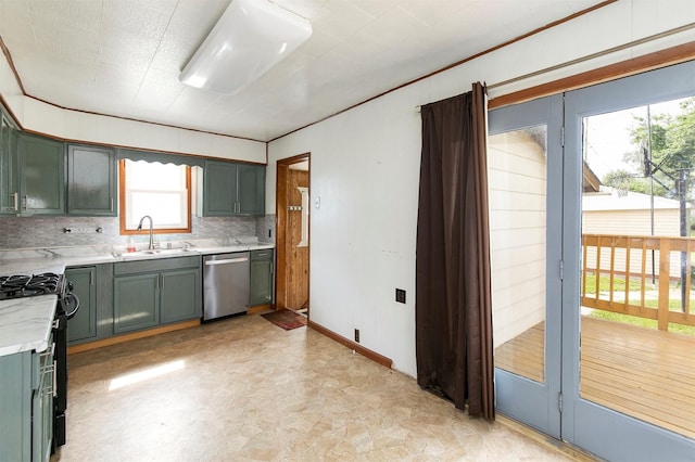 1442 Lucas Ave, Chariton, IA 50049 - kitchen with dishwasher, gas stove, light countertops, green cabinetry, and crown molding