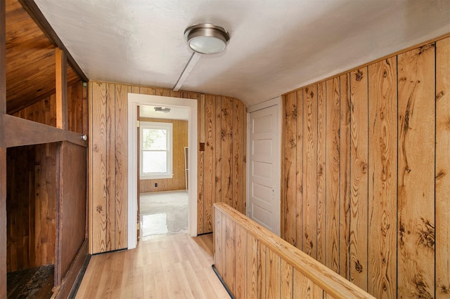 1442 Lucas Ave, Chariton, IA 50049 - corridor with wooden walls, light wood finished floors, and lofted ceiling