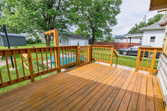 1442 Lucas Ave, Chariton, IA 50049 - wooden deck with an outbuilding and a garage