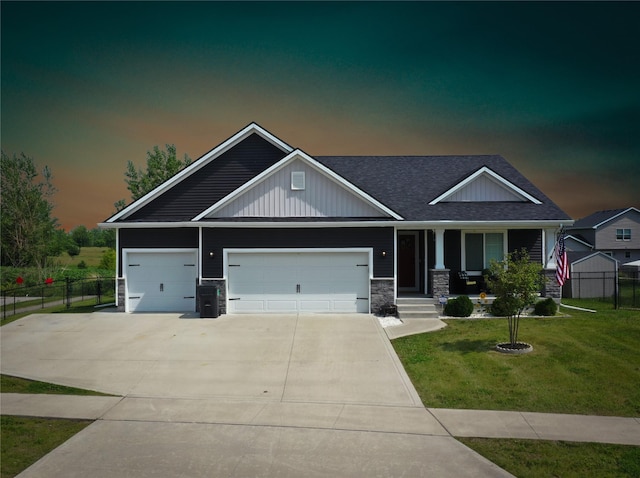 5453 Rowling Dr, Ames, IA 50014 - craftsman house with concrete driveway, covered porch, an attached garage, roof with shingles, and board and batten siding