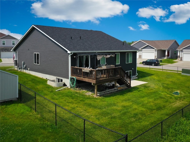 5453 Rowling Dr, Ames, IA 50014 - back of house with a wooden deck, a fenced backyard, and roof with shingles