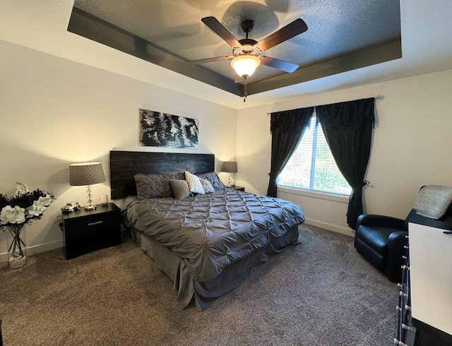 5453 Rowling Dr, Ames, IA 50014 - bedroom featuring a tray ceiling, carpet, a ceiling fan, and a textured ceiling