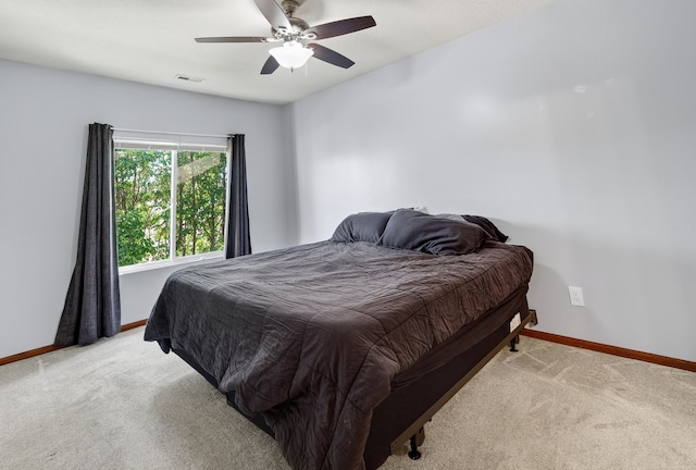 10320 Norfolk Dr Unit 7, Johnston, IA 50131 - bedroom featuring light carpet and ceiling fan