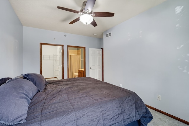 10320 Norfolk Dr Unit 7, Johnston, IA 50131 - carpeted bedroom with connected bathroom and ceiling fan