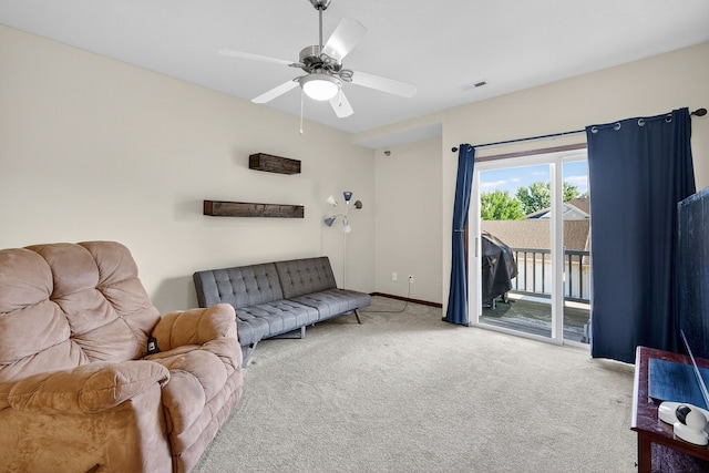 10320 Norfolk Dr Unit 7, Johnston, IA 50131 - carpeted living area featuring ceiling fan and baseboards