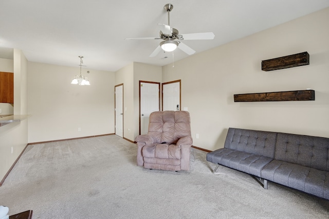 10320 Norfolk Dr Unit 7, Johnston, IA 50131 - carpeted living room featuring ceiling fan and a chandelier