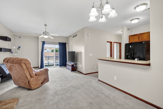 10320 Norfolk Dr Unit 7, Johnston, IA 50131 - living area featuring light colored carpet, a chandelier, and a ceiling fan