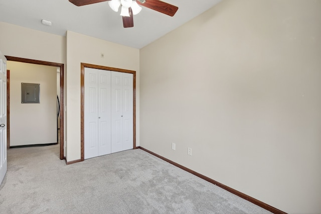 10320 Norfolk Dr Unit 7, Johnston, IA 50131 - unfurnished bedroom featuring electric panel, light carpet, a closet, and a ceiling fan