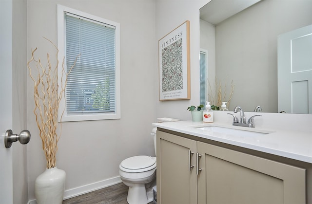 16621 Goodman Dr, Urbandale, IA 50323 - bathroom featuring vanity and wood finished floors