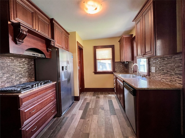 400 W Salem Ave, Indianola, IA 50125 - kitchen with stainless steel appliances, under cabinet range hood, tasteful backsplash, and dark wood-style flooring