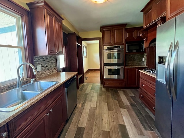 400 W Salem Ave, Indianola, IA 50125 - kitchen featuring black appliances, dark wood finished floors, and decorative backsplash