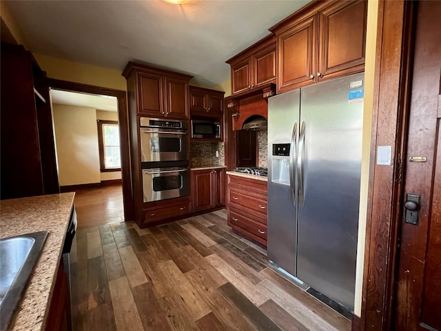 400 W Salem Ave, Indianola, IA 50125 - kitchen with appliances with stainless steel finishes, dark wood-style flooring, decorative backsplash, and light countertops