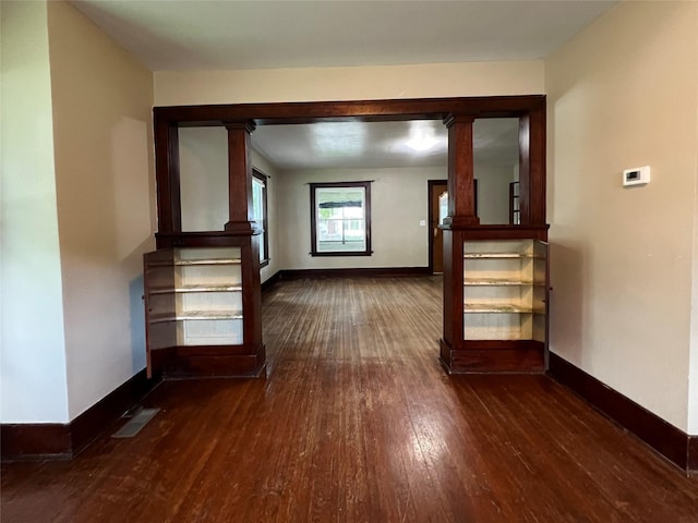 400 W Salem Ave, Indianola, IA 50125 - unfurnished living room featuring dark wood finished floors and baseboards