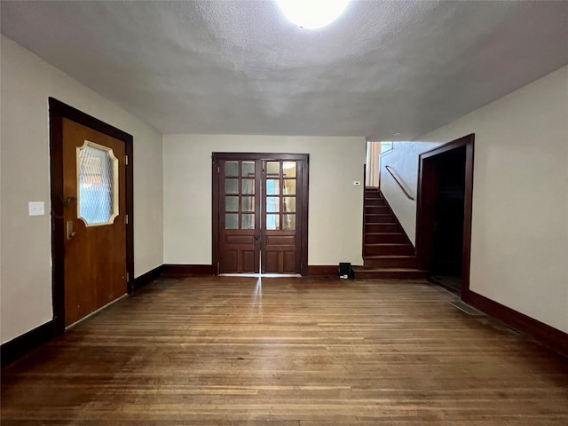 400 W Salem Ave, Indianola, IA 50125 - entryway with wood-type flooring, stairway, and a textured ceiling