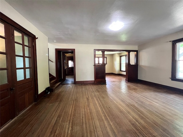 400 W Salem Ave, Indianola, IA 50125 - unfurnished room with dark wood finished floors, stairs, and plenty of natural light