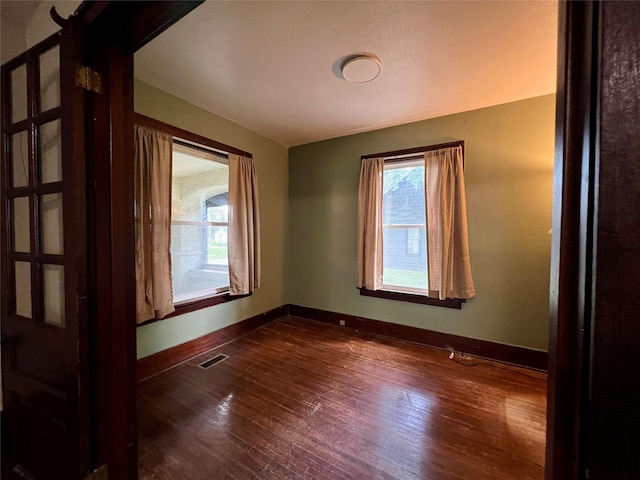 400 W Salem Ave, Indianola, IA 50125 - empty room with dark wood-style flooring and baseboards