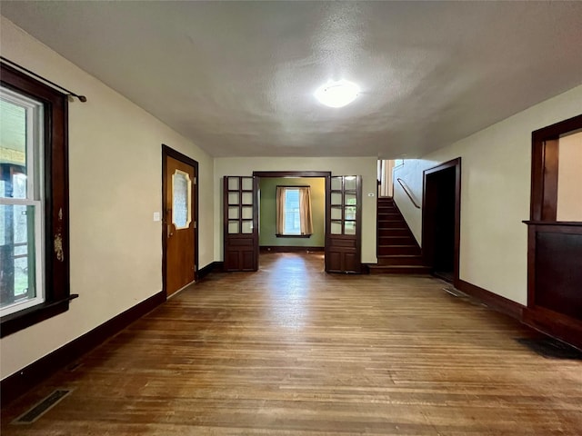 400 W Salem Ave, Indianola, IA 50125 - entrance foyer with wood finished floors, stairway, and a textured ceiling