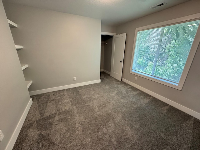 10009 Powell Ave, Johnston, IA 50131 - unfurnished bedroom with carpet floors and a closet